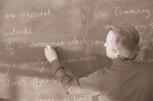 Science Teacher Writing on Black Board